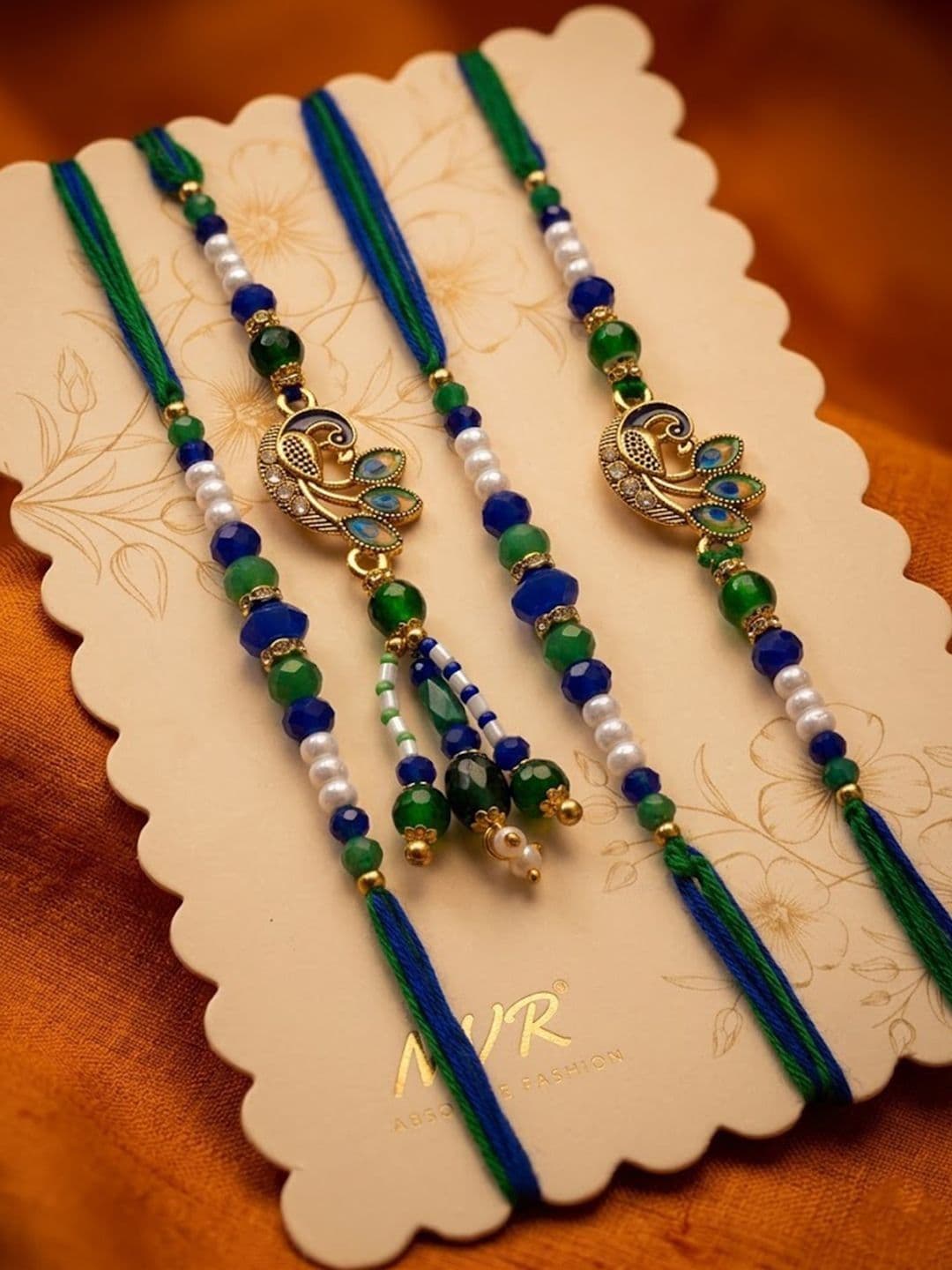 NVR Set Of 4 Green Peacock Design Artificial Beads Thread Rakhi With Roli Chawal thumbnail 3