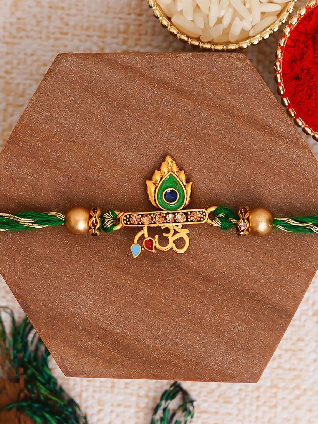 eCraftIndia Green Om & Peacock Feather Religious Rakhi with Roli Chawal - view 1