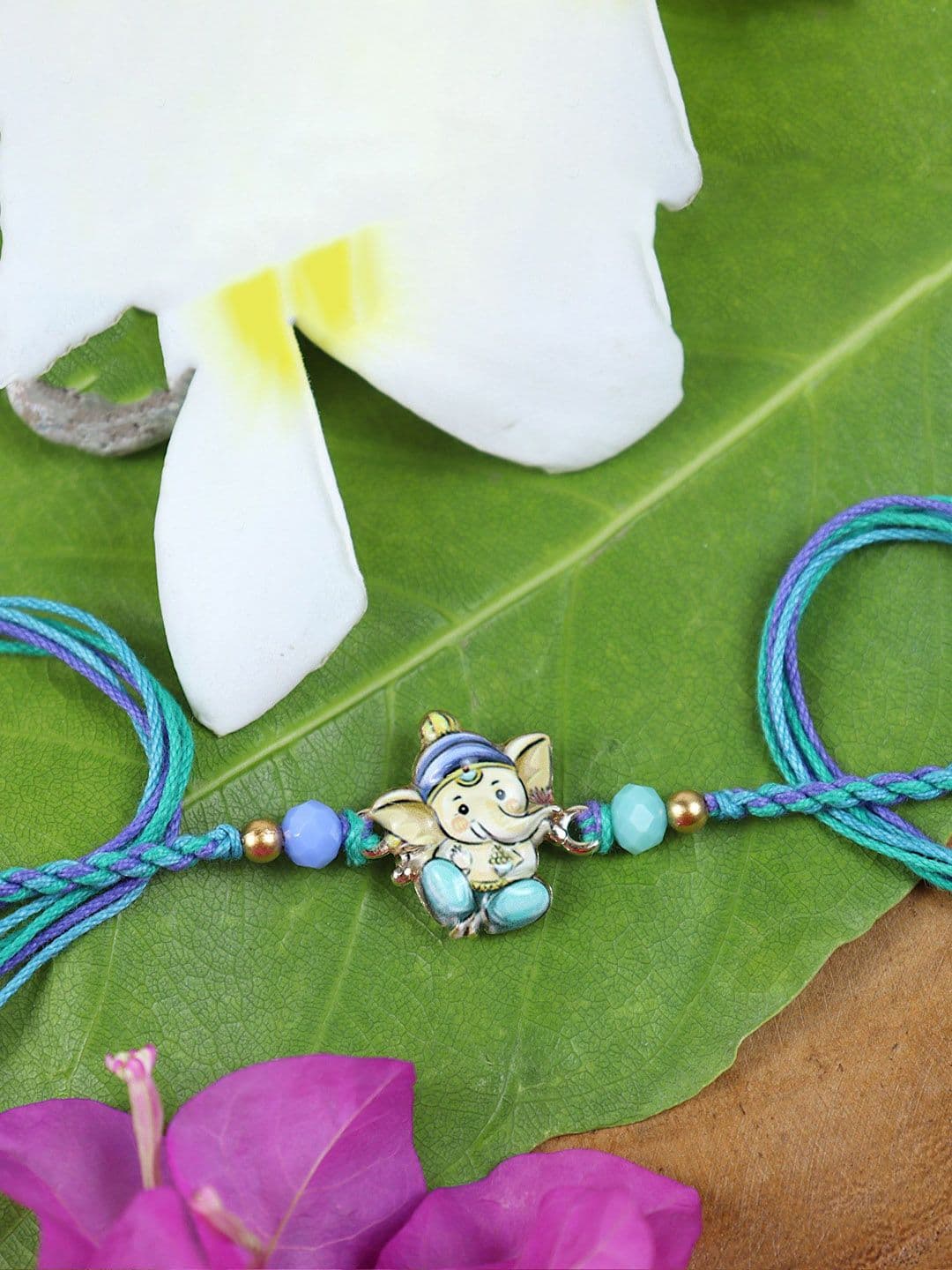 Asthetika Stones Studded Ganesha Thread Wraparound Rakhi With Roli Chawal - view 1