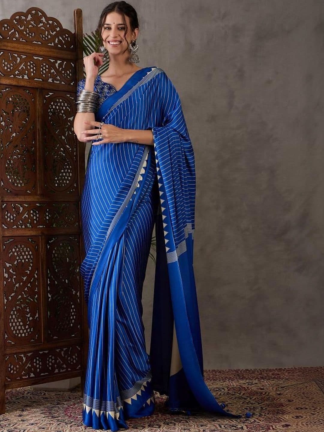 ZYVIRA Blue Ajrakh Printed Saree With Tassles And Unstitched Blouse - view 1