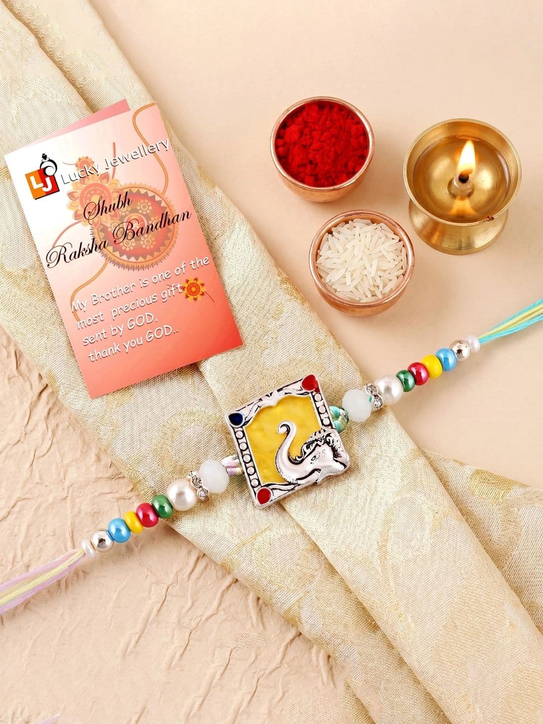 LUCKY JEWELLERY Silver Finish Krishna Flute Mor Pankh Beaded Rakhi Set with Roli Chawal - view 1