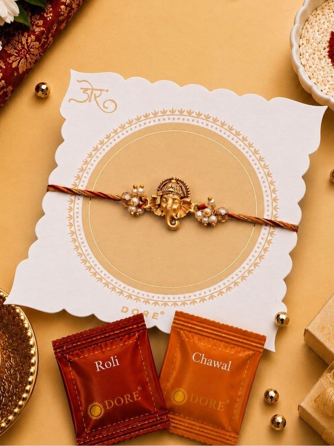 Dore Antique Ganesha Pearl Rakhi with Premium Roli Chawal - view 1