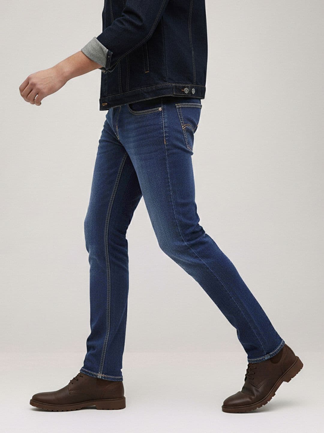 The Roadster Life Co. Men Slim Fit Mid-Rise Light Fade Stretchable Jeans With Bag - view 1