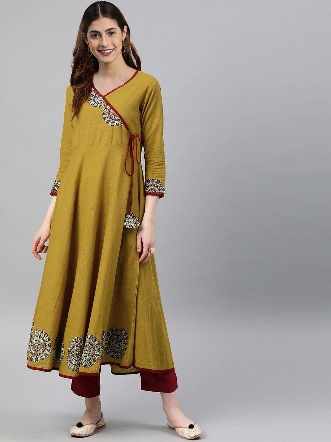 KALINI Women Mustard Yellow Floral Printed Angrakha Anarkali Kurta with Tassel Tie-Up - view 1