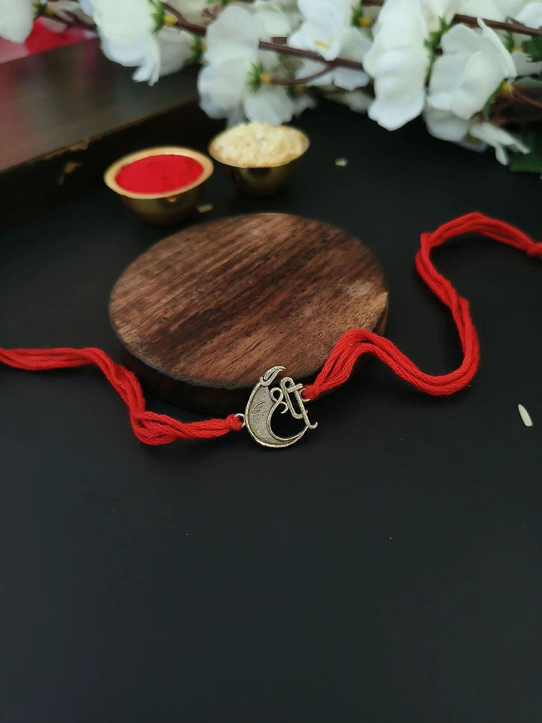 Sangria Red Shree Ganesha Thread Rakhi - view 1